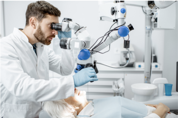 Caucasian male dentist in the operating room for ENDODONTISTS cover for prodent search